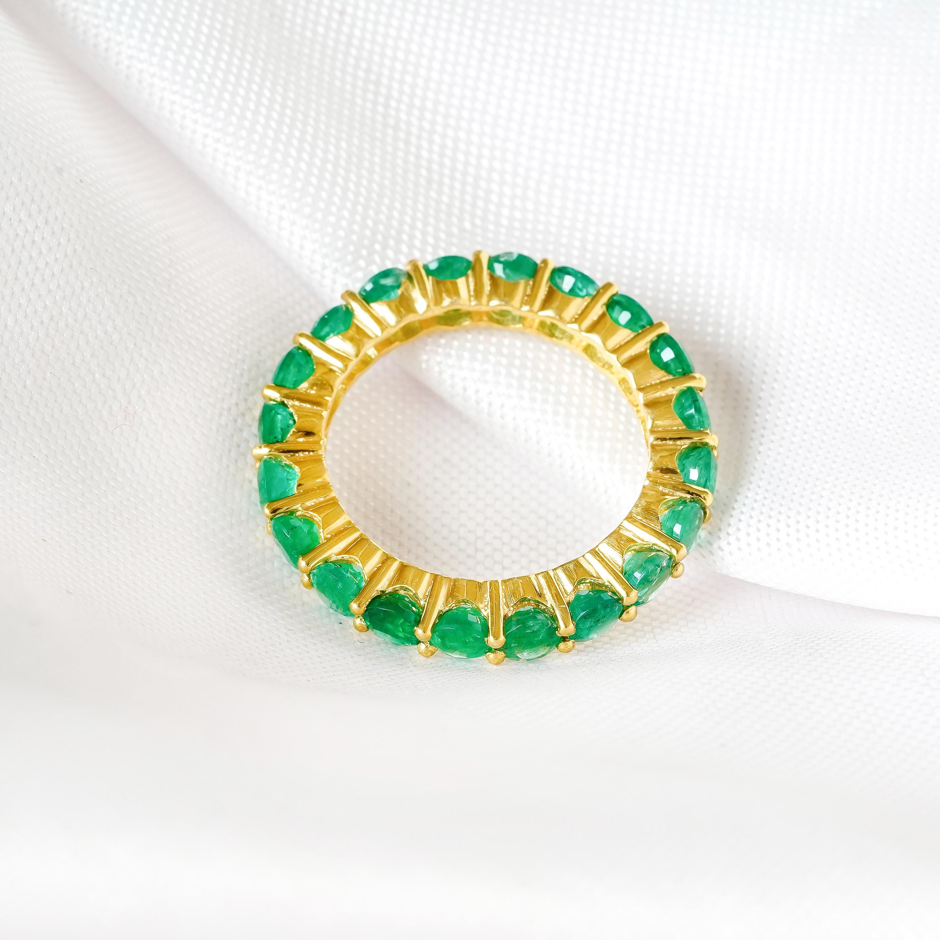 Dainty emerald wedding band for everyday wear